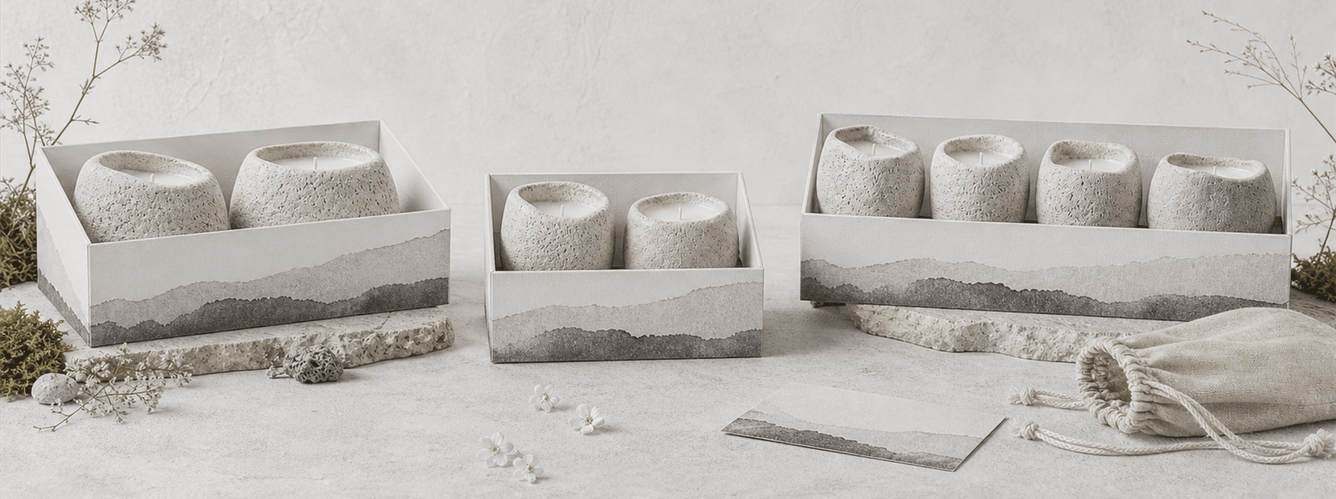 EMBER & MOSS stone candle gift sets arranged with dried botanicals