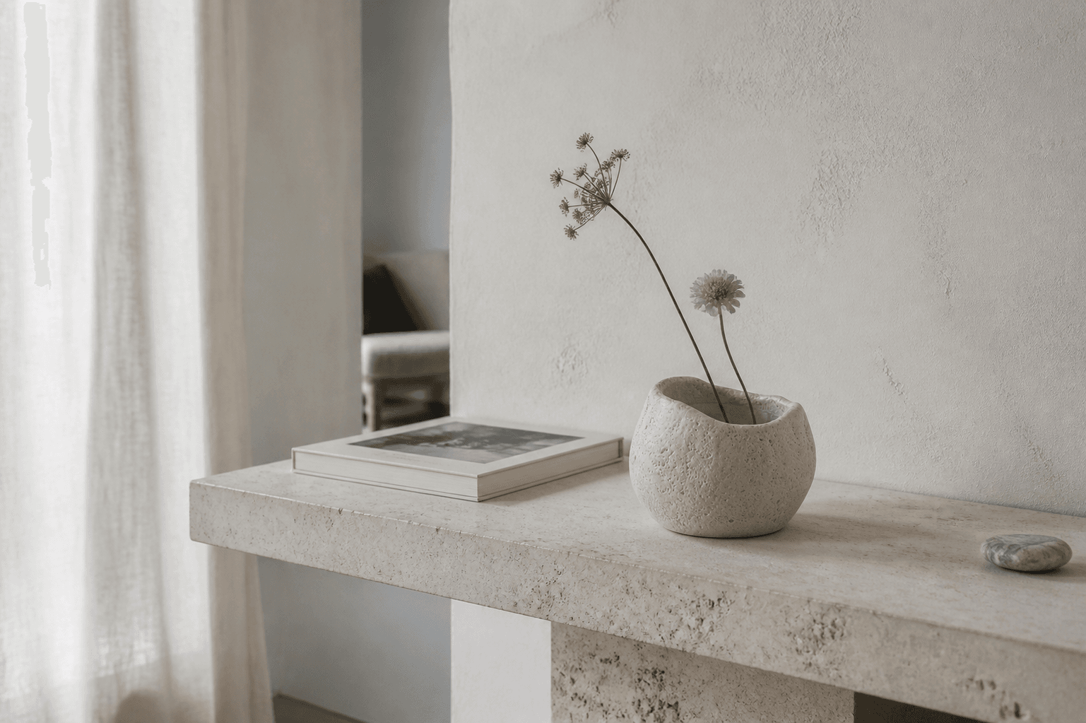 An empty stone vessel reused as a vase at home