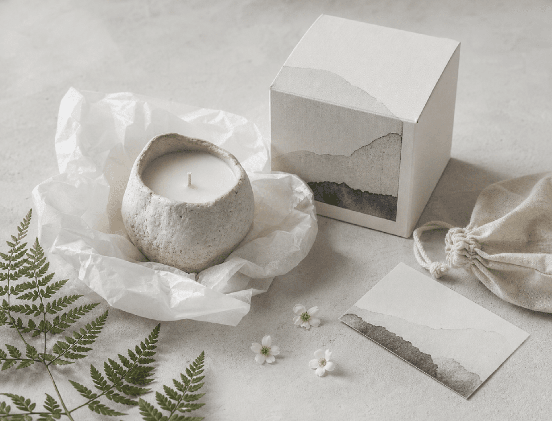 A hand-finished candle and its packaging
